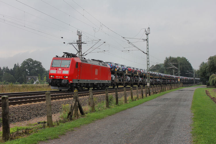 DB 185 113-8 mit Autotransportzug am 11.09.2013 durch Langwedel-Fört.