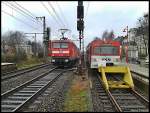 Am 12.03.14 in Elmshorn RegionalExpress nach Kiel Hbf mit Schublok 112 176 und daneben an A3 nach Ulzburg Süd