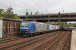 185 CL-009 Vermietet an VPS macht sich auf dem Weg mit ihrem Containerzug und durchfährt am 30.08.2014 den Bahnhof Hamburg Harburg.