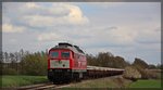 232 241 mit ihrem Schwellenzug aus Möllenhagen bei Kraase in Richtung Kargow am 18.04.2016