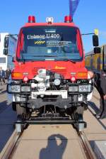 Der Merzedes Benz Unimog U400 als Zweiwege Feuerwehr Fahrzeug mit Ziegler Aufbau steht am 23.09.2014 auf der InnoTrans 2014 Ausgestellt.